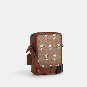 Coach X Peanuts Sullivan Crossbody Bag In Signature Canvas With Snoopy Print.